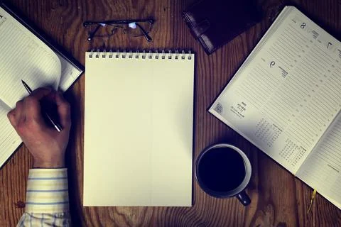 Toned table write hand top view Foto stock