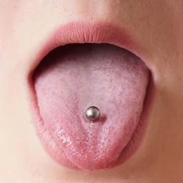 Tongue piercing Stock Photos