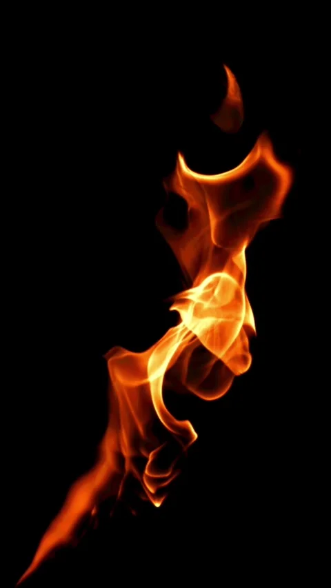Tongues of bright fire on a black background. Filmed on a high-speed camera at Stock Footage 335363047