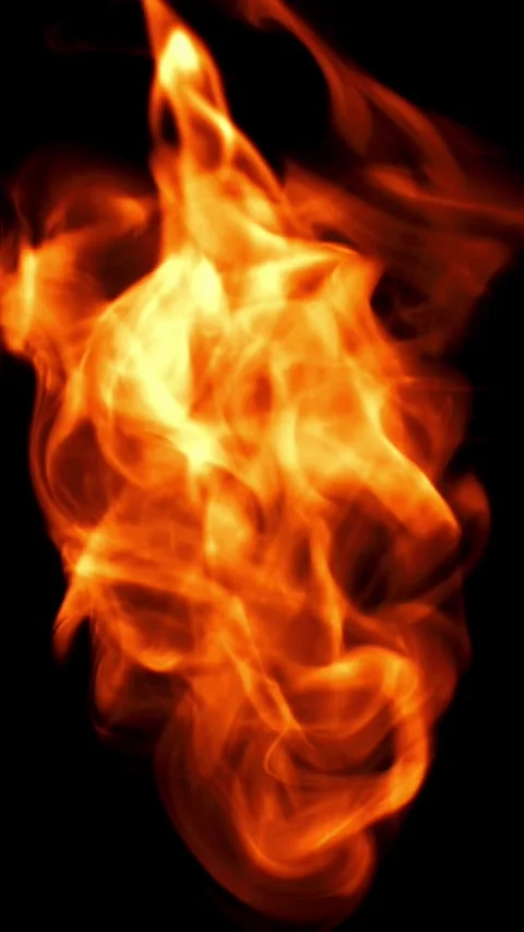 Tongues of bright fire on a black background. Filmed on a high-speed camera at Stock Footage 335363358