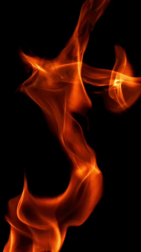 Tongues of bright fire on a black background. Filmed on a high-speed camera at Stock Footage 335363438