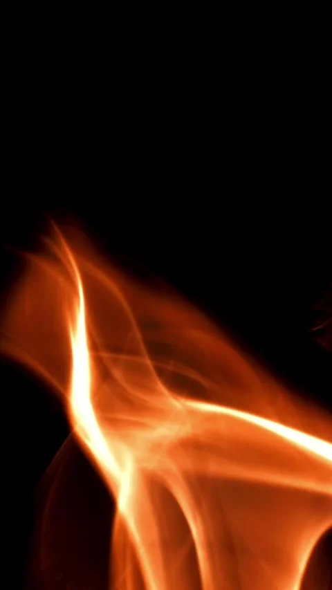 Tongues of bright fire on a black background. Filmed on a high-speed camera at Stock Footage 335369268
