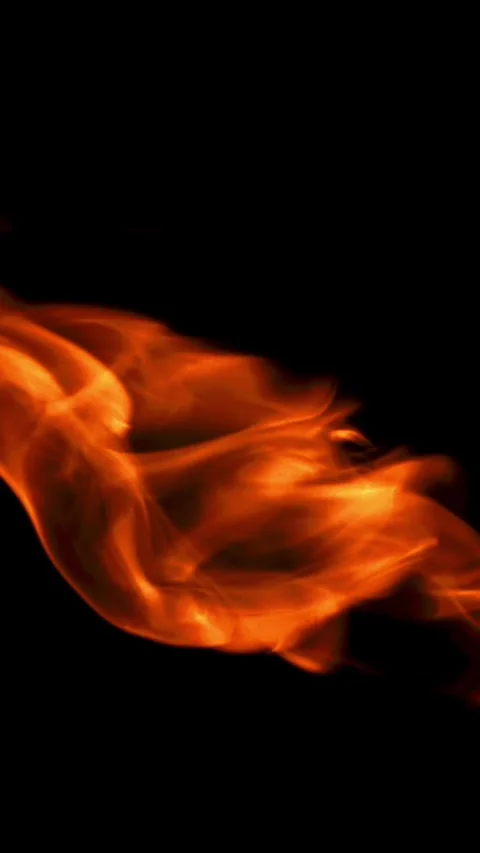 Tongues of bright fire on a black background. Filmed on a high-speed camera at Stock Footage 335369410