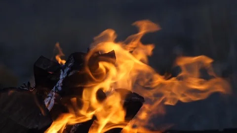 Tongues of flame on a dark background Stock Footage 84273362