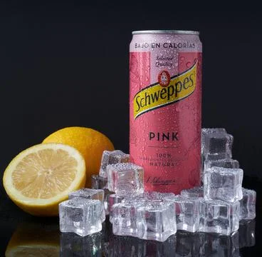 Tonica Pink with ice and lemons on a dark background Stock Photos