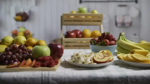 Tons of gorgeous, beautiful fruit on kitchen table, tracking shot Stock Footage 341193845
