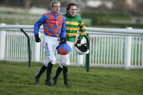 Tony Mccoy And Ruby Walsh After Falling At The Second Last During The 14:35 Iris Stock Photos