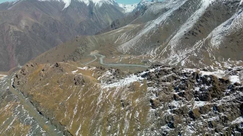 Too-Ashuu Pass Beyond the Mountain Ridge, Kyrgyzstan. Drone View Stock Footage 340922344