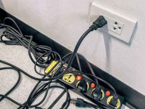 Too many plugs in a socket Stock Photos