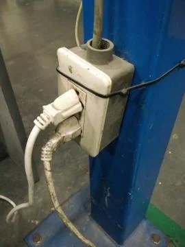 Too many plugs in a socket Stock Photos