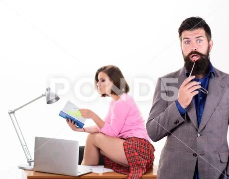 Too smart to fall for this. Bearded man in smart casual wear with sexi coworker Stock Photos