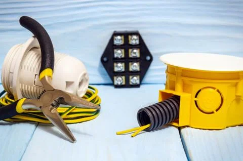 Tool and accessories used in electrical installation or repair on blue wooden Stock Photos