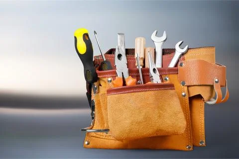 Tool belt with tools on light background Stock Photos