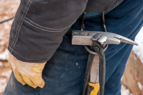 Tool on the belt of the worker for quick work. 스톡 사진
