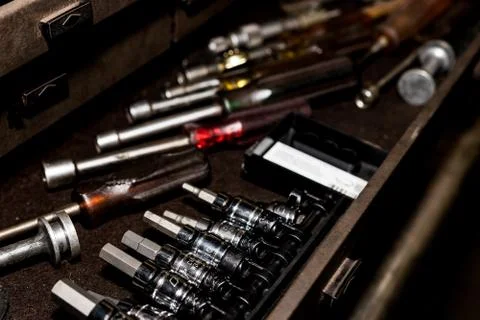 Tool box drawer with hex sockets, nut drivers, and various tools Stock Photos