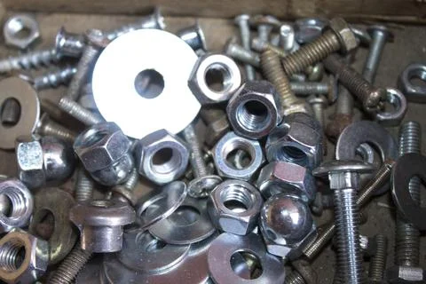 Tool box full of screws, clips, nails, fasteners Stock Photos