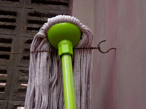 A tool for cleaning floors, often called a mop Stock Photos