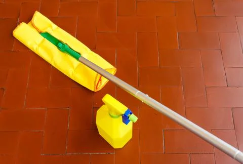 A tool for dusting the floors and the cleaner to wash it 스톡 사진