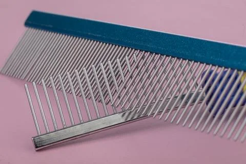 Tool for the groomer. Set of different combs for pet hair care on a white bac Stock Photos
