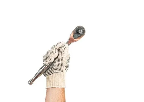 Tool. Hand in glove is holding socket wrench isolated on white background . Фото