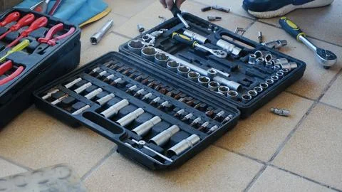 Tool kit with various sockets and wrenches displayed on a work surface, sho.. Stock Photos