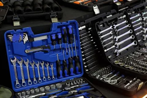 Tool kits in plastic boxes on the showcase Stock Photos