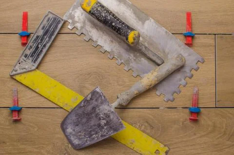 A tool for laying ceramic tiles in the form of a tree.Trowel, Toothed trowel, Stock Photos