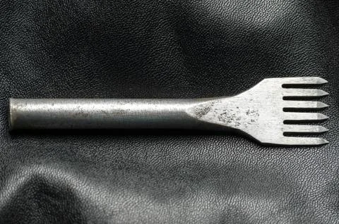 Tool for making holes in leather. Artificial Stock Photos