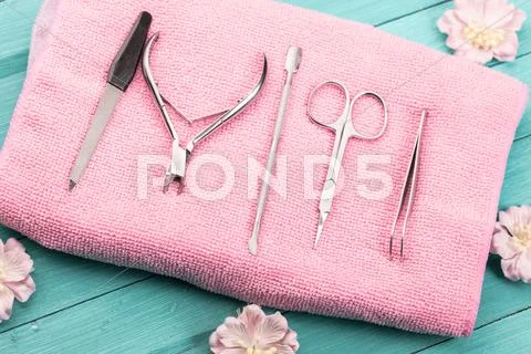 Tool for manicure on pink towel Stock Photos