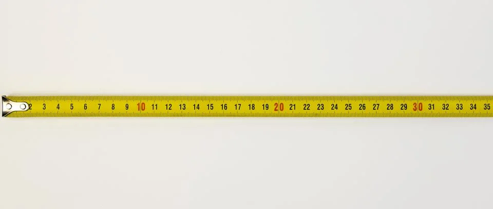 A tool for measuring length. Construction measuring tape on a white background. Stock Photos