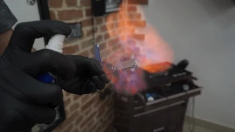 Tool Razor Disinfection With The Help Of A Roasting Fire In The Barbershop Stock Footage 122165862
