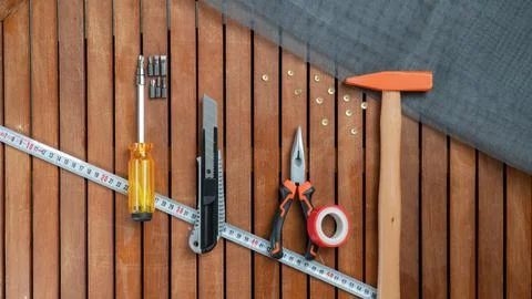 Tool set - hammer, wire cutters, centimeter, screwdriver, construction net Stock Photos
