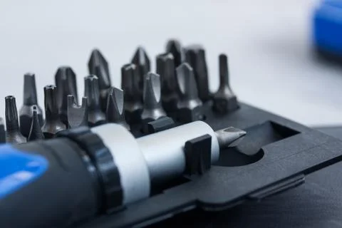 Tool set screwdriver with different nozzles and screws macro Stock Photos