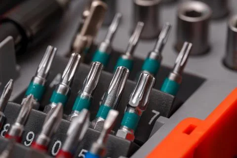 Tool set with various screwdriver bits organized in a storage tray showing .. Stock Photos