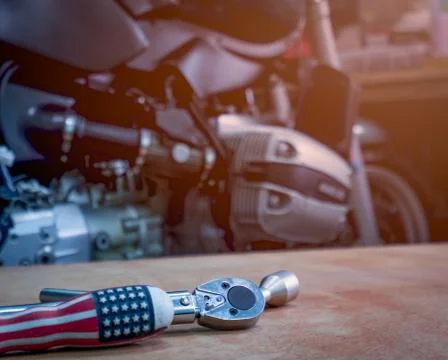 Tool on the table with single cylinder head cover of a motorcycle Foto stock