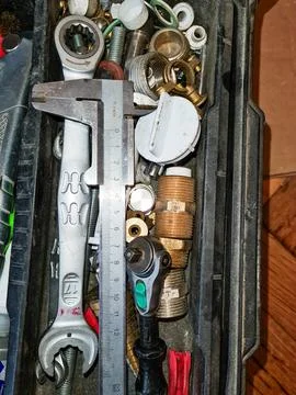Toolbox filled with various tools and hardware Stock-Fotos