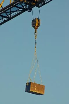 Toolbox hanging off a construction crane Stock Photos
