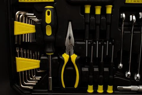 Toolbox, various devices and sizes, on black background, detailed shot Stock Photos
