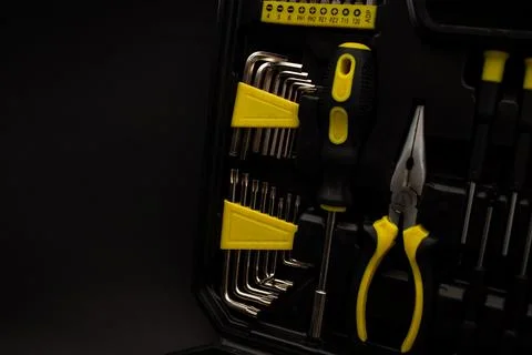 Toolbox, various devices and sizes, on black background, detailed shot Stock Photos