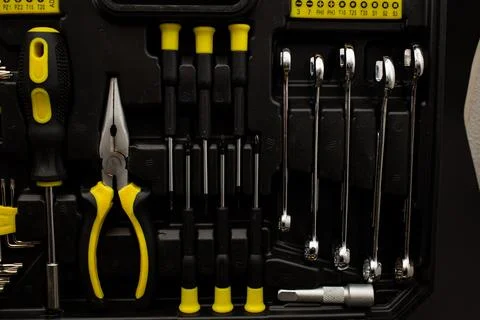 Toolbox, various devices and sizes, on black background, detailed shot Stock Photos