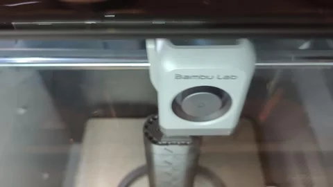 The toolhead assembly of a Bambu Lab X1 Series 3D printer. 스톡 동영상 345850121