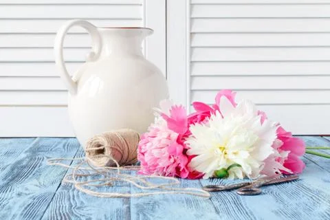 Tools and accessories florists need for making up a bouquet out of peonies Stock Photos
