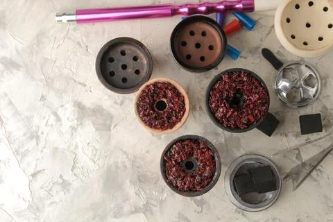 Tools and accessories for making hookah, clay bowls with tobacco, coconut cha Stock Photos