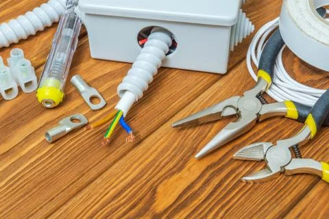 Tools and accessories used in electrical installation or repair on a vintage Stock Photos
