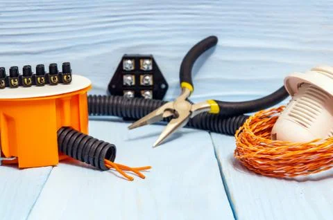 Tools and accessories used in electrical installation or repair on blue woode Stock Photos