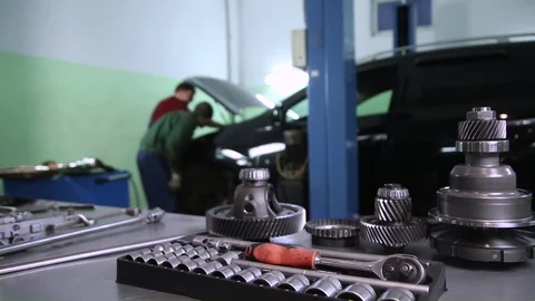 Tools and auto parts in the background of the service Stock Footage 70556265