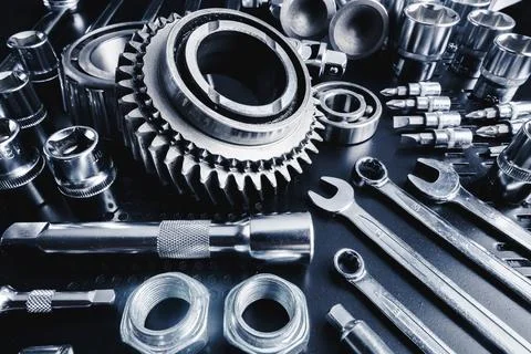 Tools and gears arranged on a workbench showcasing precision engineering and Stock Photos