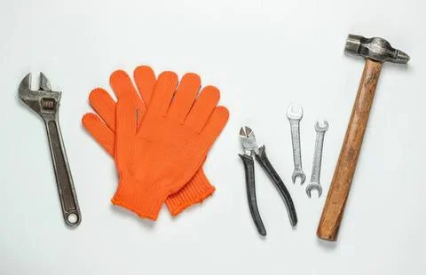 Tools and gloves on a white background for repair work Stock Photos