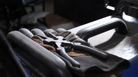 Tools and gloves on workshop bench Stock Footage 311944223