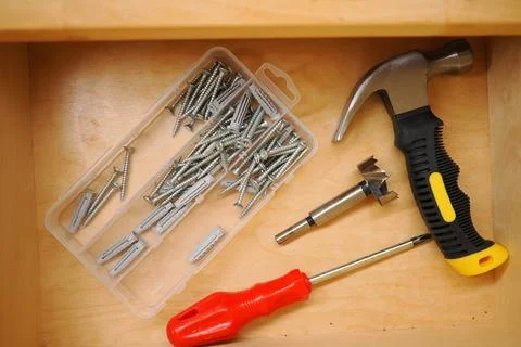 Tools and hardware items arranged in a drawer Stock Photos